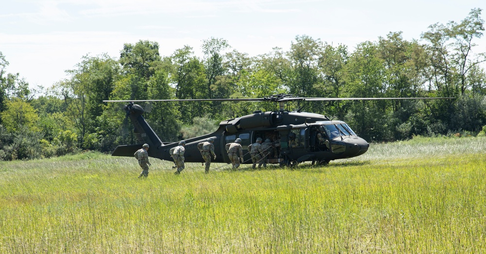 Soldiers rappel from UH-60 Black Hawk During Air Assault