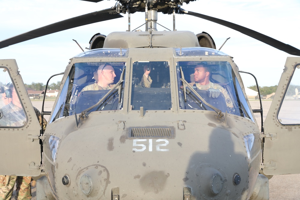 TNARNG officers perform preflight checks before an air assault mission during Northern Strike 22