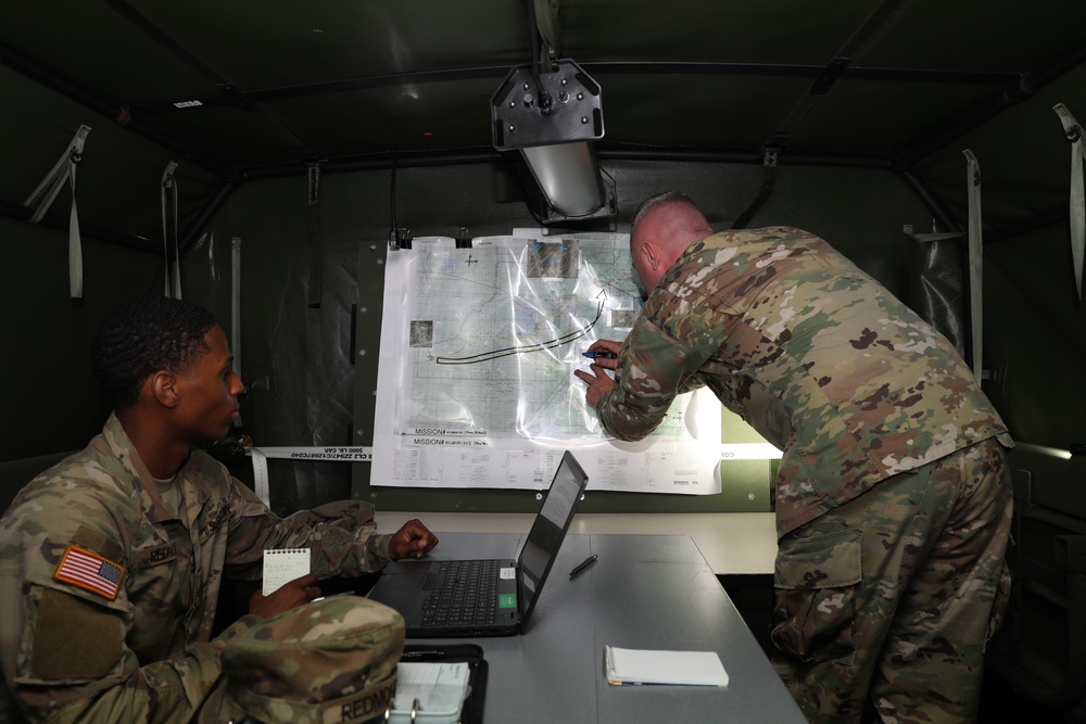 The 29th CAB staff prepares for an air assault mission in the Tactical Command Post