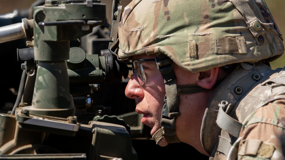 1-134th Field Artillery Regiment conduct a fire mission at Northern Strike 22