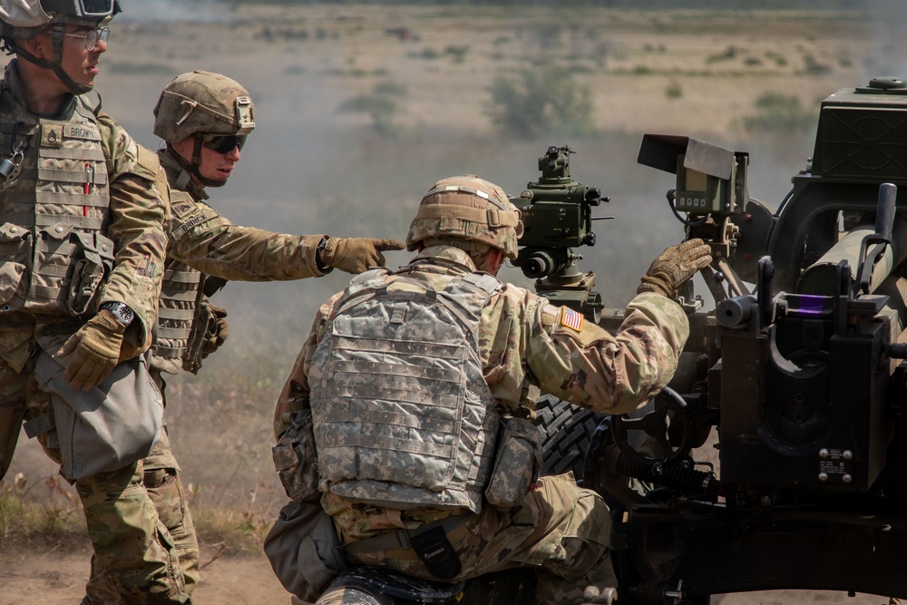 1-134th Field Artillery Regiment conduct a fire mission at Northern Strike 22