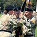 Lt. Gen. Jody J. Daniels, Chief of the Army Reserve receives the colors from Maj. Gen. Miguel Castellanos