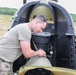 Chinook mechanic works on a CH-47 chinook