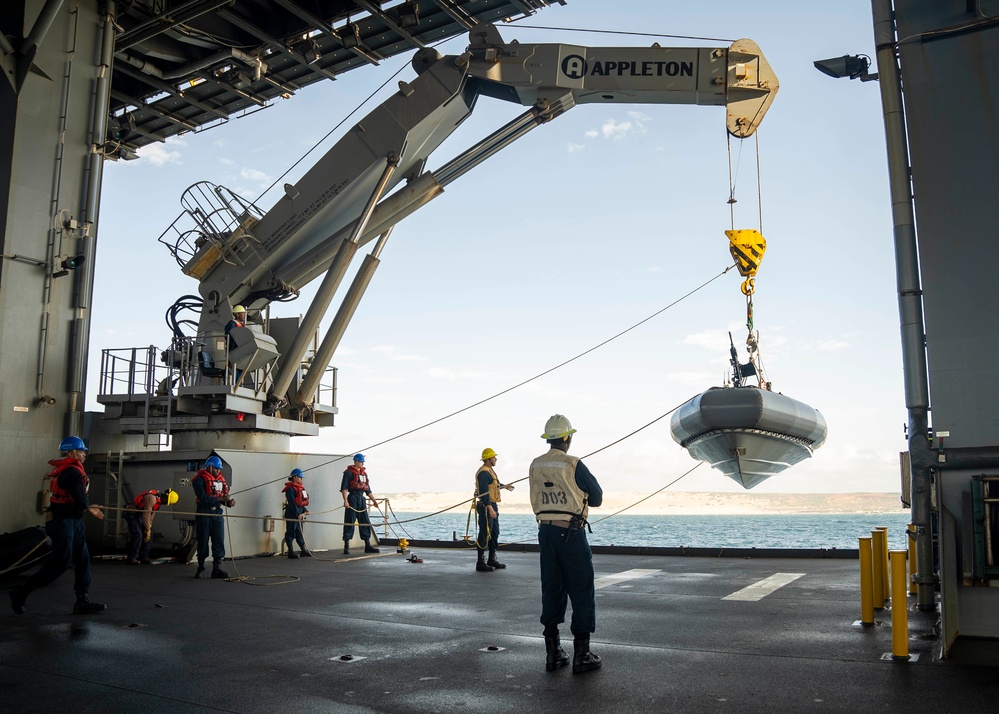 Sailors deploy small boats