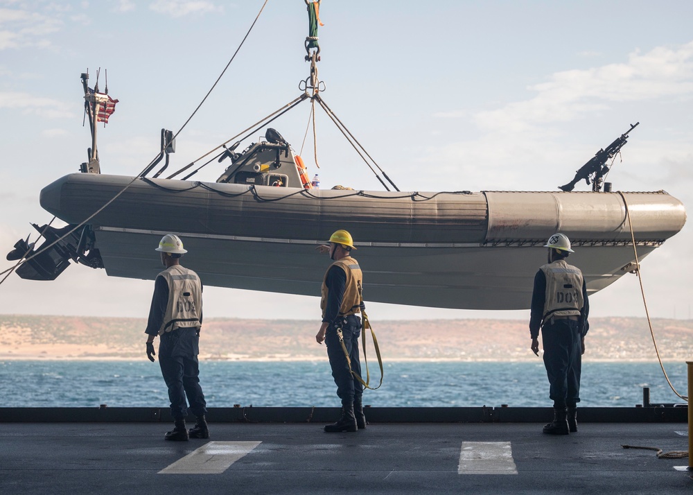 Sailors deploy small boats