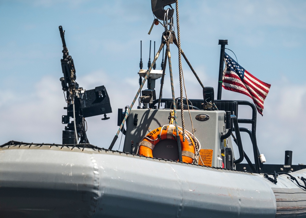 Sailors deploy small boats