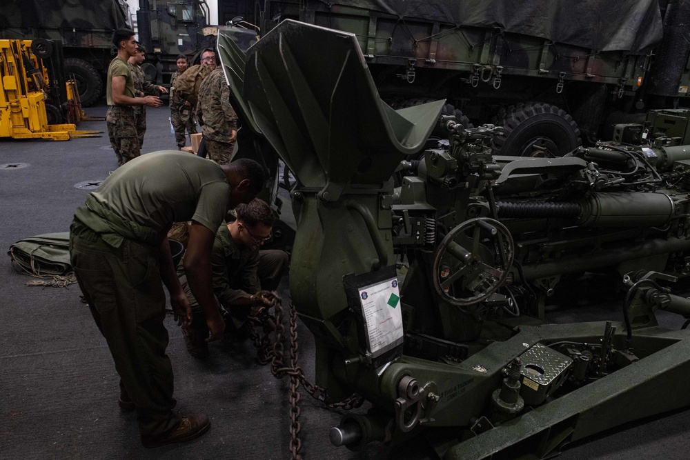 Securing a Howitzer Cannon aboard USS New Orleans August 13, 2022