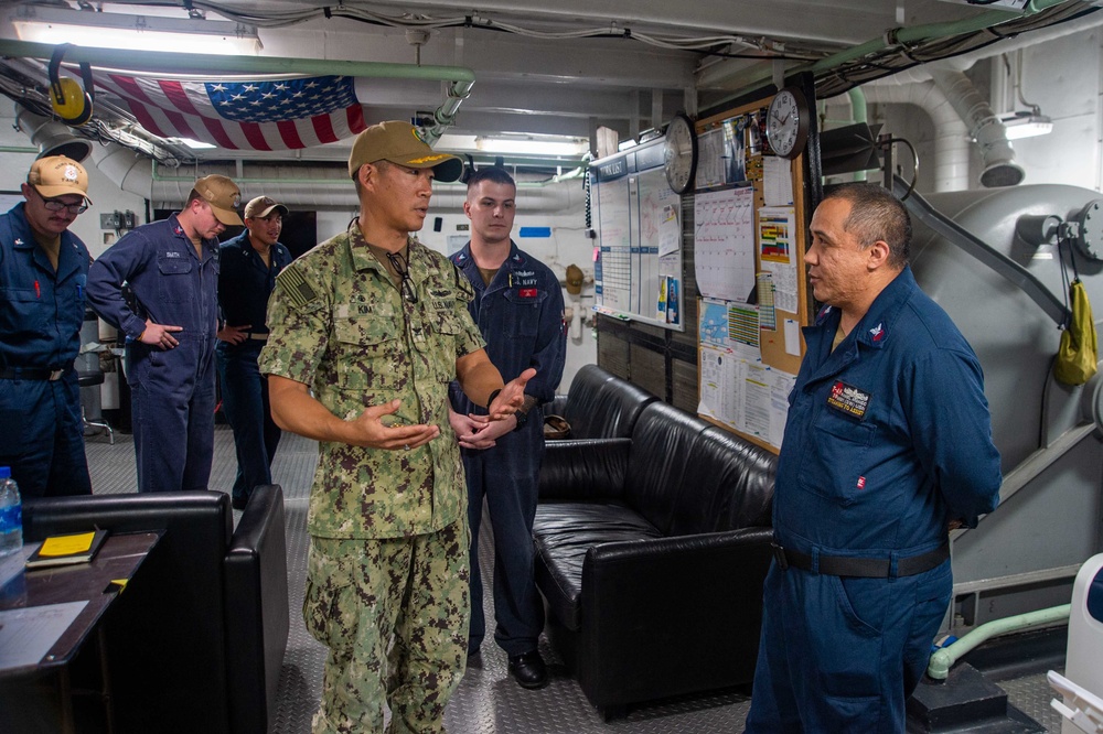 Mission Commander of Pacific Partnership 2022 presents coins to Sailors