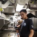 USS George H.W. Bush (CVN 77) Sailor cooks for the crew.