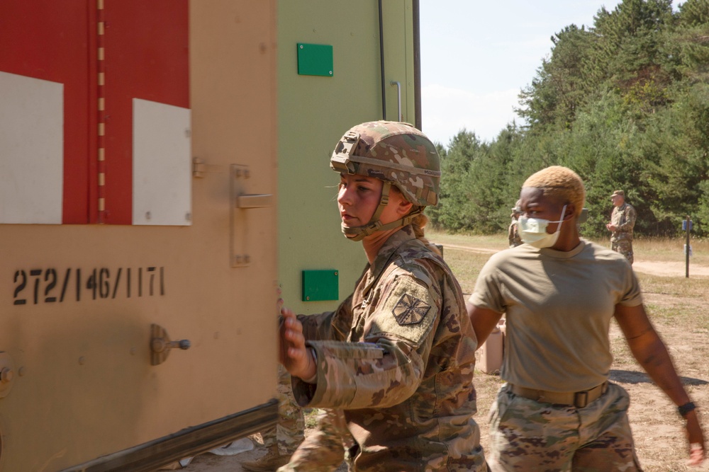 Cpl. Raechel McKiernan Opens a Humvee 2-CT Ambulance During a Mass Casualty Simulation at Northern Strike 22-2