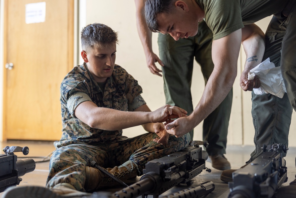 Marines with Marine Heavy Helicopter Squadron (HMH) 461 clean machine guns