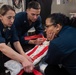 USS Ronald Reagan (CVN 76) Sailors pack and prepare parachutes