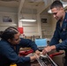 USS Ronald Reagan (CVN 76) Sailors pack and prepare parachutes