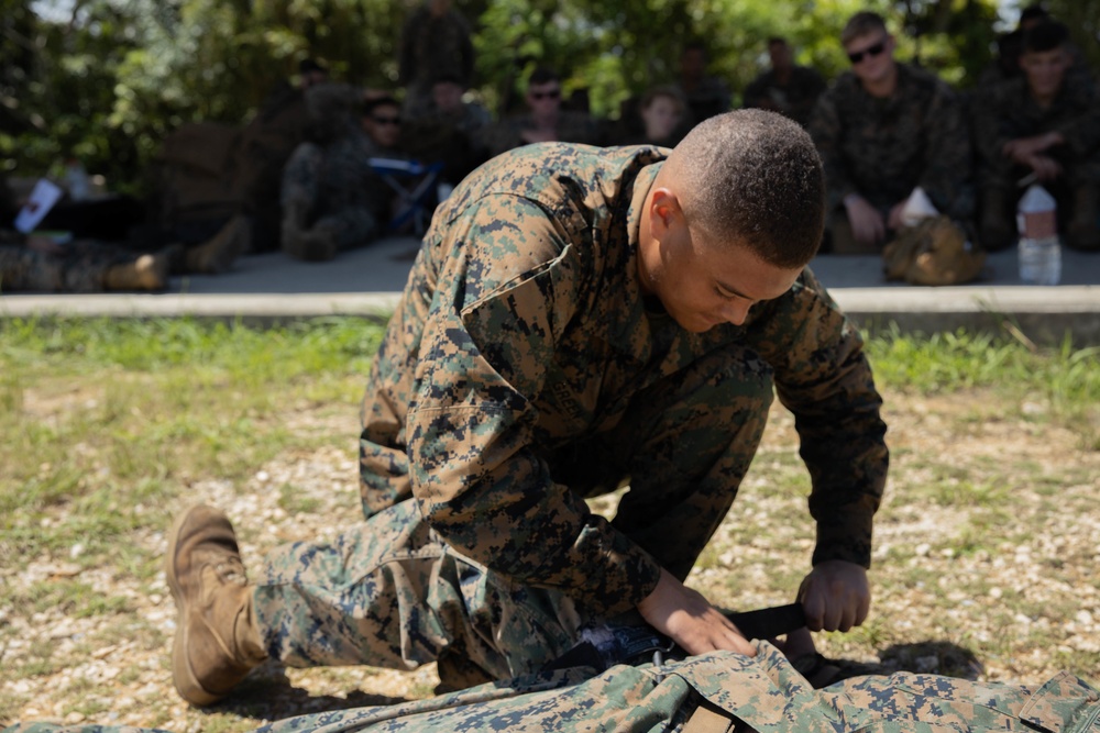 Marines with CLB- 4 conduct Tactical Combat Casualty Care training, machine gun range