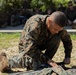 Marines with CLB- 4 conduct Tactical Combat Casualty Care training, machine gun range