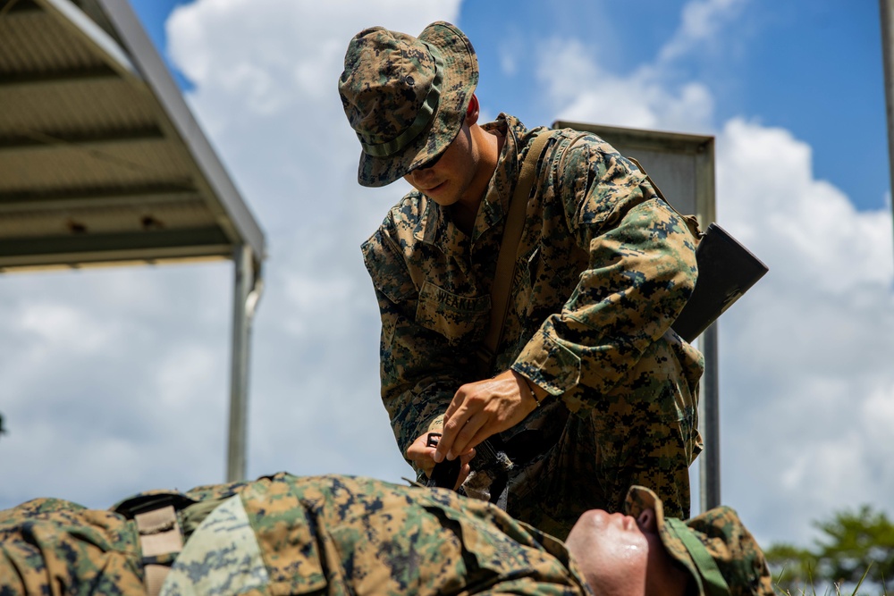 Marines with CLB- 4 conduct Tactical Combat Casualty Care training, machine gun range