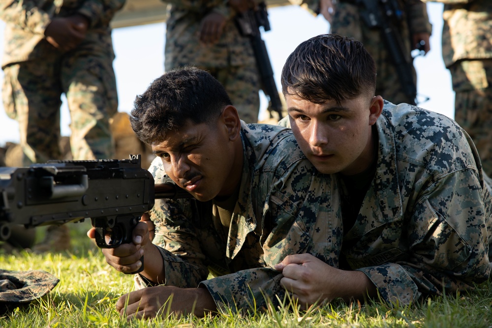 Marines with CLB- 4 conduct Tactical Combat Casualty Care training, machine gun range