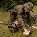 Marines with CLB-4 conduct Tactical Combat Casualty Care training, machine gun range