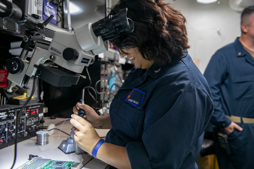 USS George H.W. Bush (CVN 77) Sailor Solders Electrical Equipment