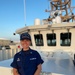 Commanding Officer Stands Aboard Coast Guard Cutter Charles Sexton