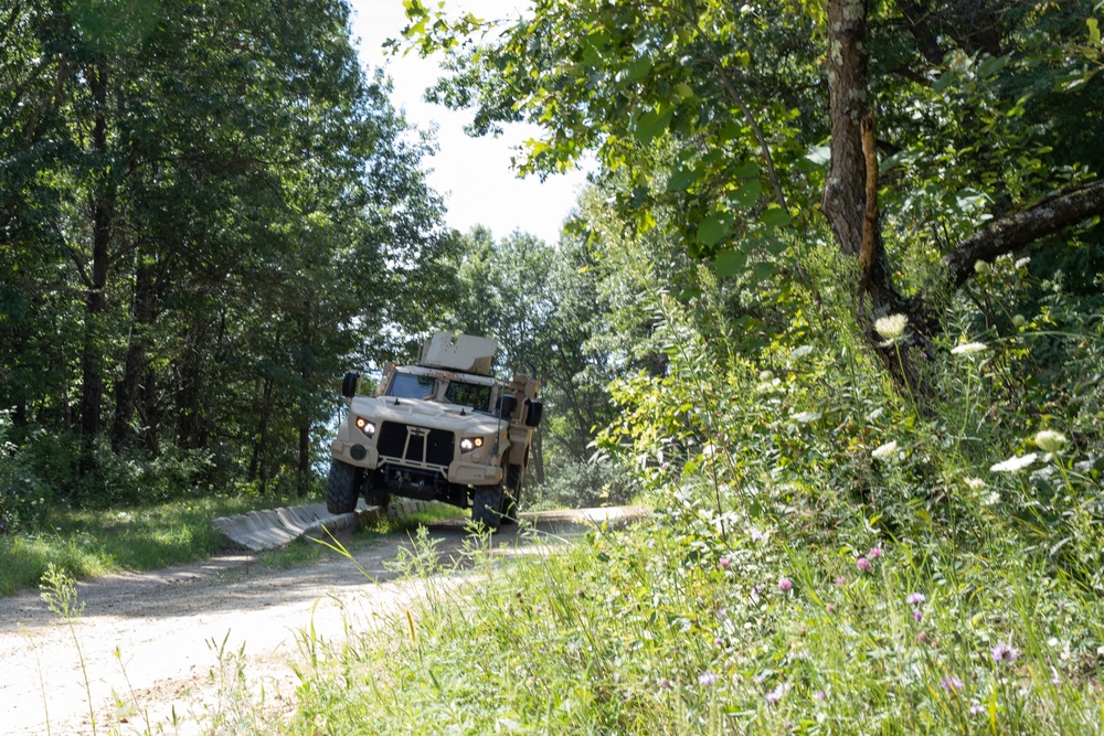 JLTV Rides a High Curb on Obstacle Course