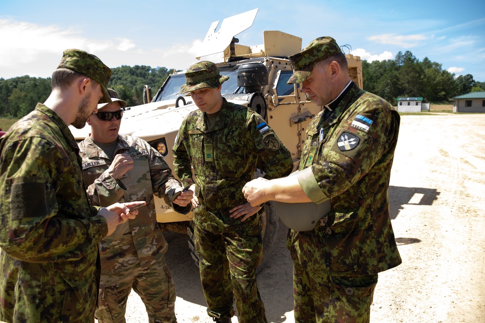 U.S. Army Reserve Master Sergeant Explains Unit Patch to Estonian Soldiers