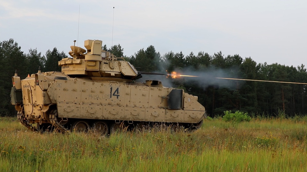 Troopers with 3rd Armored Brigade Combat Team, 1st Cavalry Division fire the 25mm cannon on a Bradley fighting vehicle 