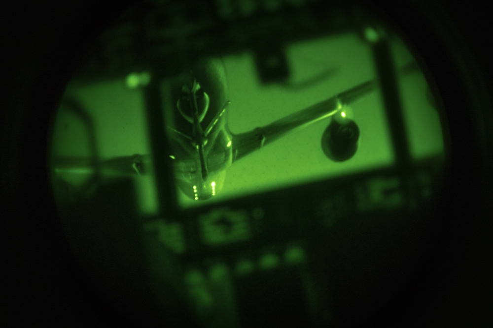 MC-130 Commando IIs conduct nighttime three-ship formation operations