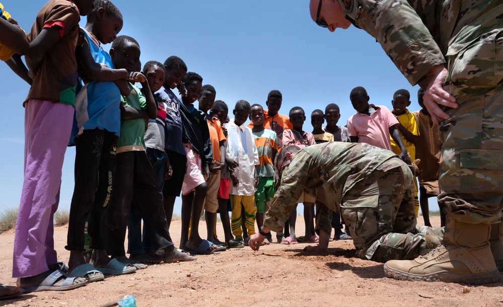 U.S. military members spend time with local Nigerien children