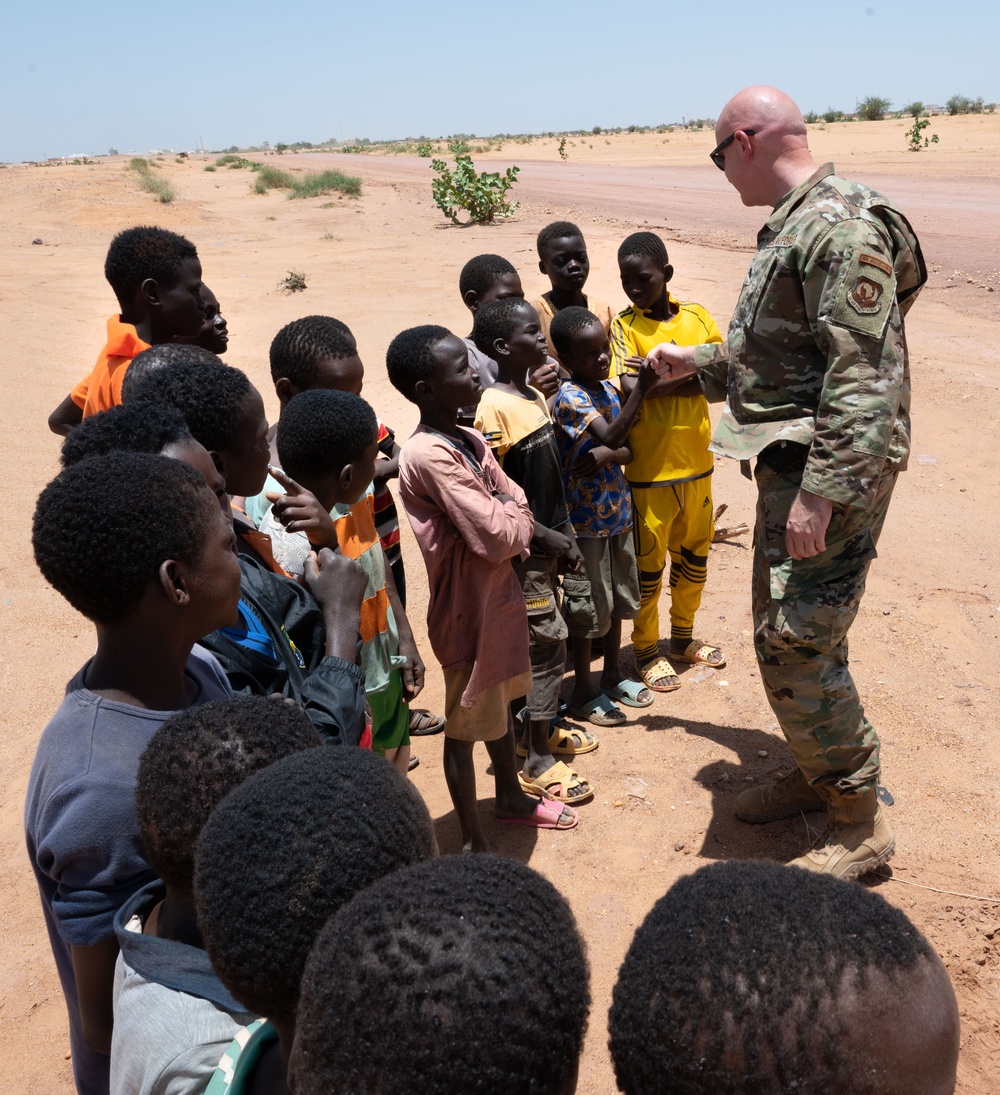 U.S. military members spend time with local Nigerien children
