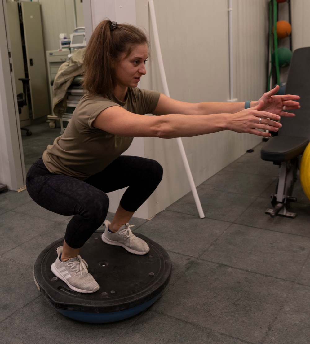 332d Expeditionary Medical Squadron administers rehabilitation treatment for injured Airmen.