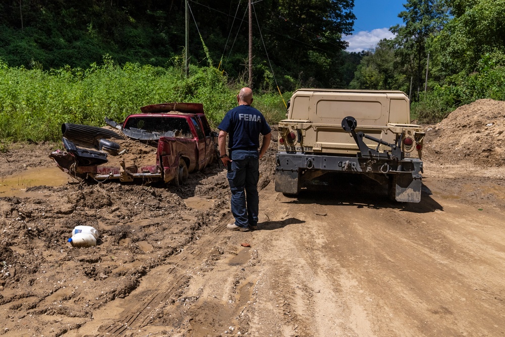 FEMA Disaster Survivor Assistance team members reach out to disaster survivors in Eastern Kentucky with the help of U.S. Army personnel