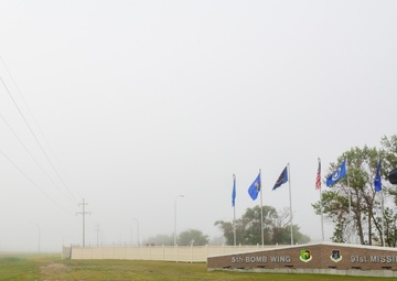 Heavy fog covers a sign at the front of the base entrance at Minot Air Force Base