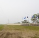 Heavy fog covers a sign at the front of the base entrance at Minot Air Force Base