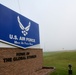 Heavy fog covers a sign at the front of the base entrance at Minot Air Force Base