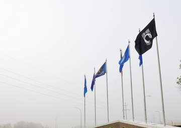 Heavy fog covers a sign at the front of the base entrance at Minot Air Force Base