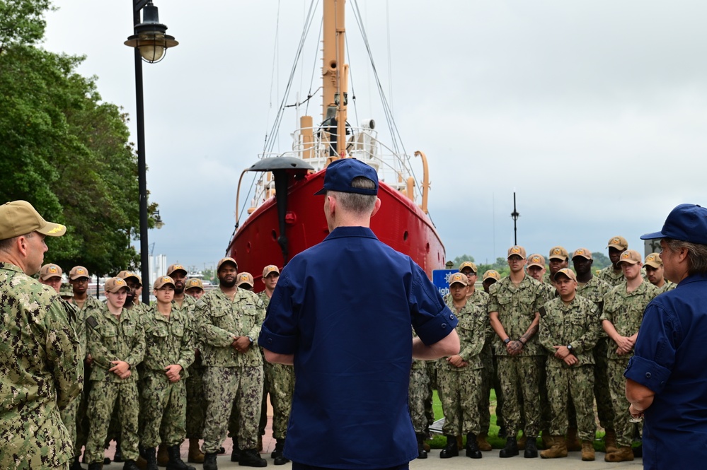 Coast Guard Vice Adm. presents the Coast Guard Special Operations Service Ribbon to crew of USS Hershel &quot;Woody&quot; Williams