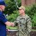 Coast Guard Vice Adm. presents the Coast Guard Special Operations Service Ribbon to crew of USS Hershel “Woody” Williams