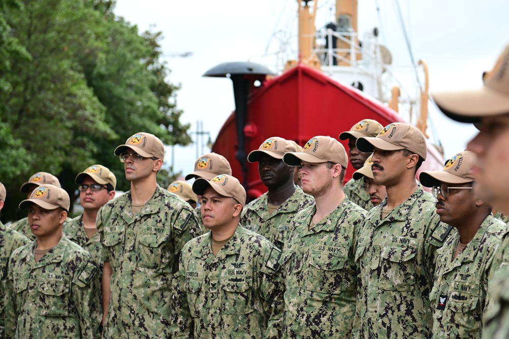 Coast Guard Vice Adm. Kevin Lunday, Atlantic Area Commander, presents the crew of the USS Hershel &quot;Woody&quot; Williams with the Coast Guard Special Operations Service Ribbon