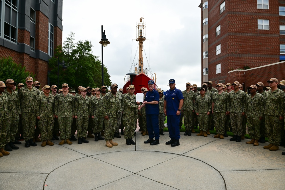 Coast Guard Vice Adm. Kevin Lunday, Atlantic Area Commander, presents the crew of the USS Hershel &quot;Woody&quot; Williams with the Coast Guard Special Operations Service Ribbon