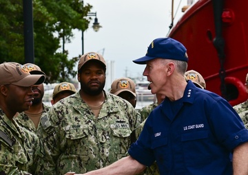 Coast Guard Vice Adm. Kevin Lunday, Atlantic Area Commander, presents the crew of the USS Hershel "Woody" Williams with the Coast Guard Special Operations Service Ribbon