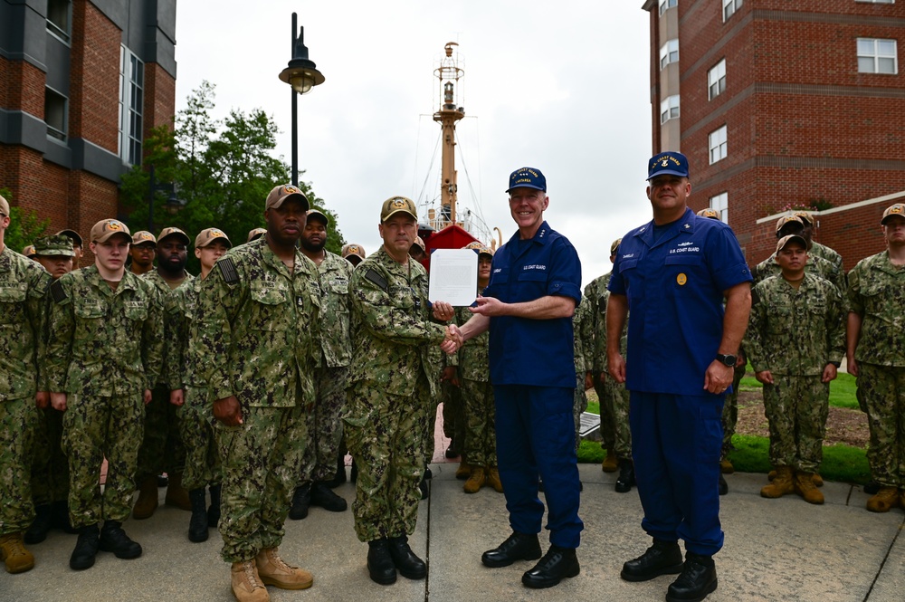 Coast Guard Vice Adm. Kevin Lunday, Atlantic Area Commander, presents the crew of the USS Hershel &quot;Woody&quot; Williams with the Coast Guard Special Operations Service Ribbon