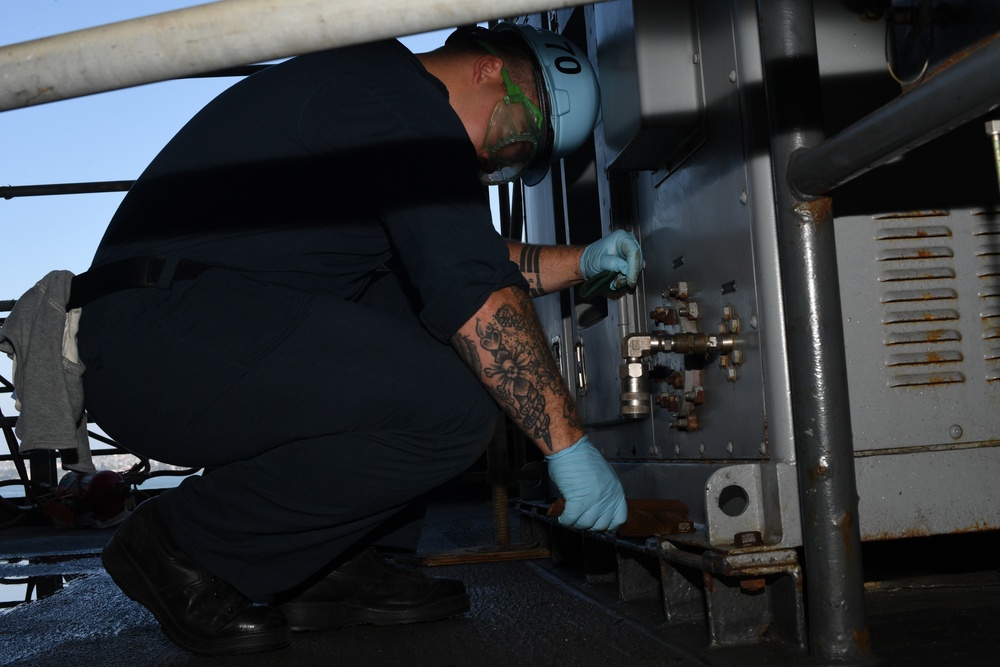Sailor conducts maintenance