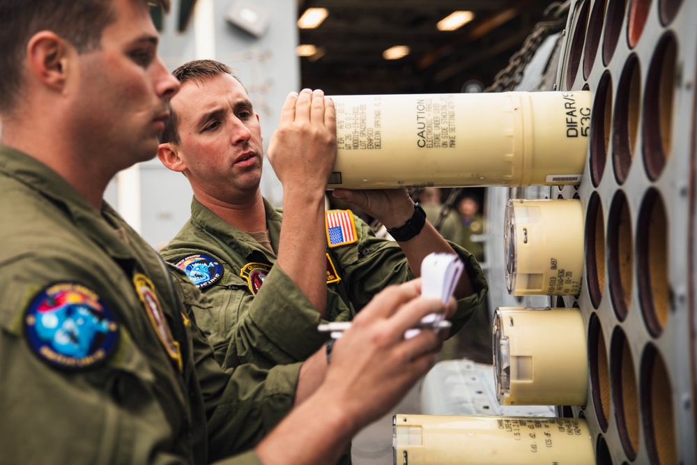 HSM 79, DET 2 Sailors Load Sonobuoys into MH-60R aboard DDG 117