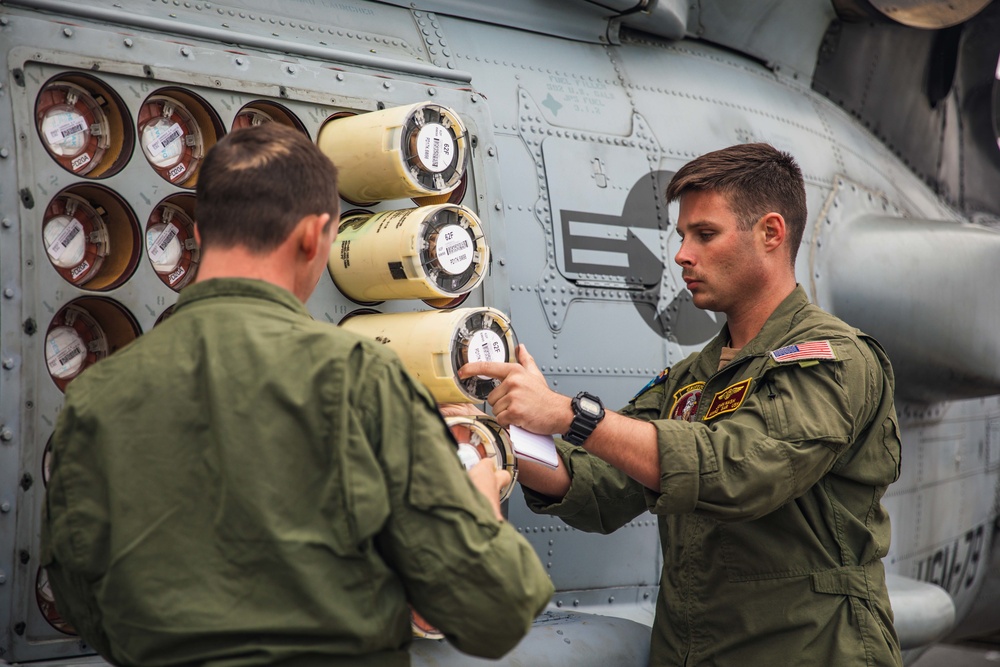 HSM 79, DET 2 Sailors Load Sonobuoys into MH-60R aboard DDG 117