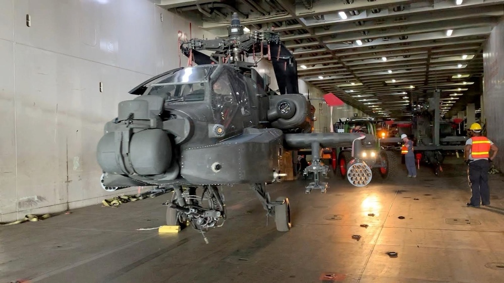 An AH-64 Apache helicopter stages in the bay of the ARC Endurance waiting to be offloaded at the Port of Esbjerg, Denmark on Aug 22, 2022. 