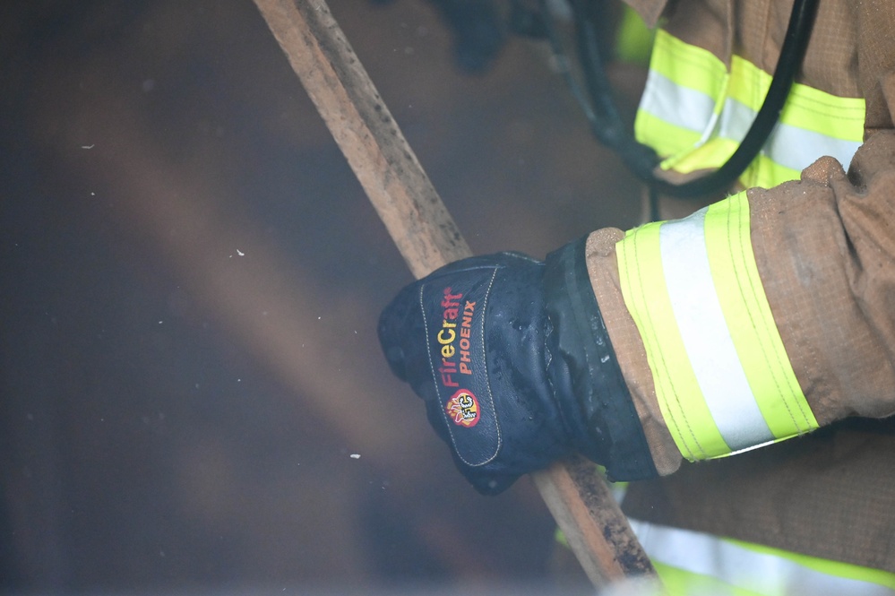 908 CES firefighters conduct annually required structure fire training