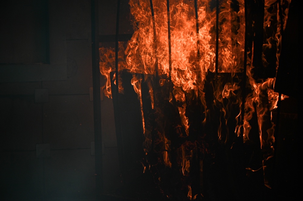 908 CES firefighters conduct annually required structure fire training