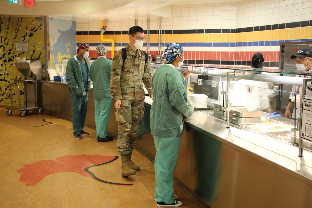 Diners at the BDAACH Cafeteria choose their meals during the Women's Equality Day celebration