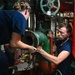 USCGC Thetis (WMEC 910) engineers make engine repairs